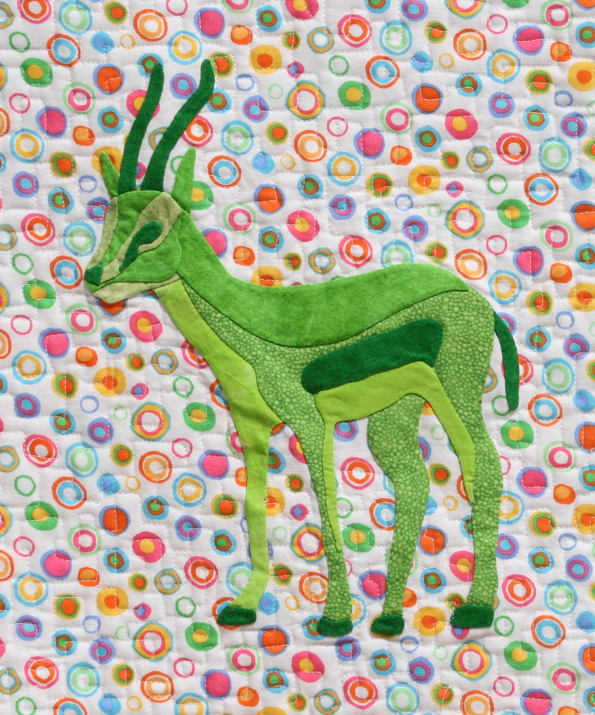 Green Gazelle on a colorful background fabric appliqué quilt pattern