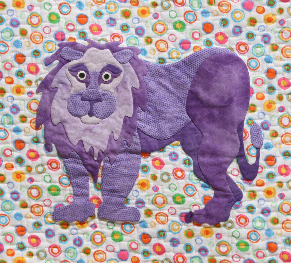 Purple lion on a colorful background fabric appliqué quilt pattern