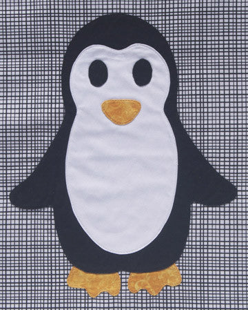 Penguin appliqué quilt pattern on a patterned black and white background fabric