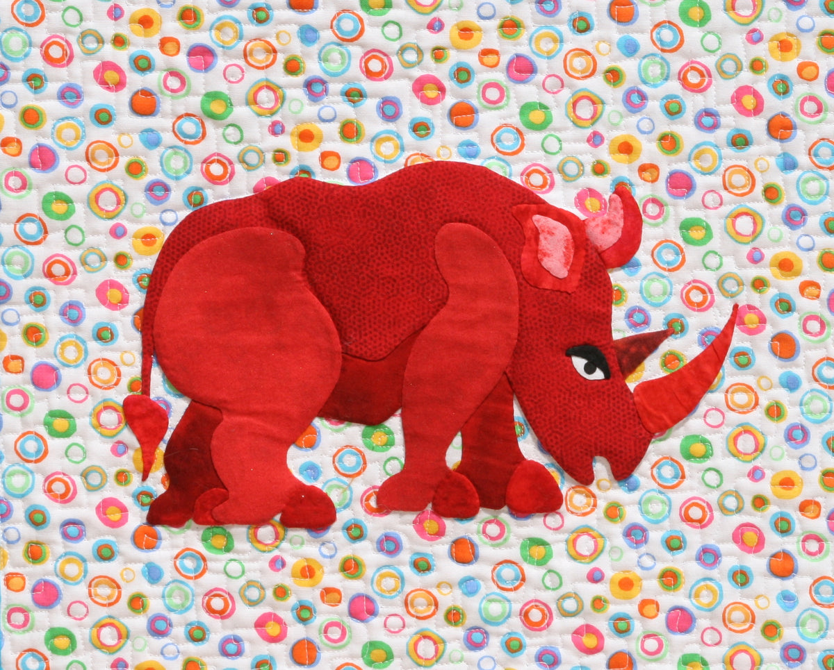 Red Rhino on a colorful background fabric appliqué quilt pattern
