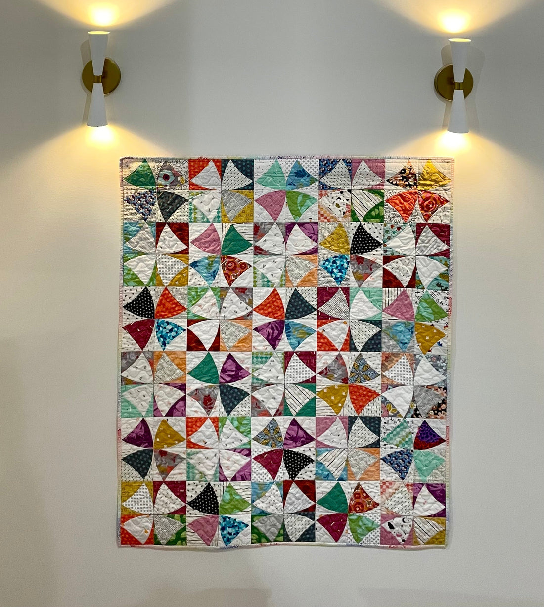 Quilt hanging flat agianst the wall