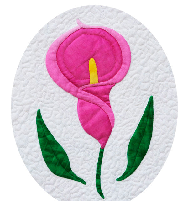 A pink Calla Lily flower with green leaves appliqué quilt pattern